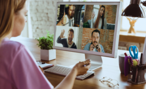 Woman working online in a video meeting