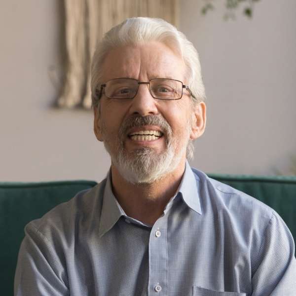 Professional headshot of an older man