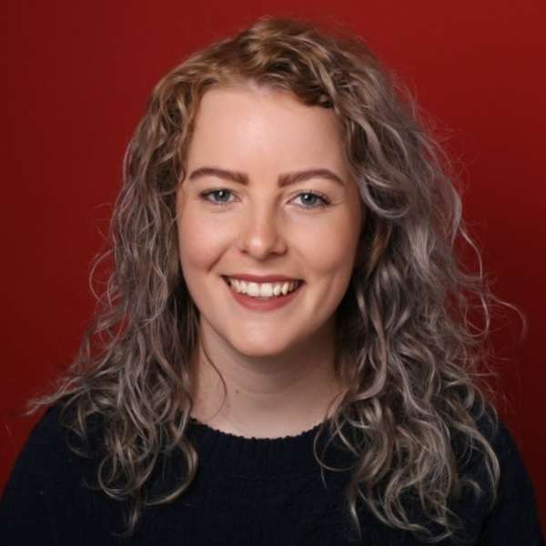 Professional headshot of a smiling woman