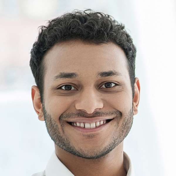 Headshot of a smiling man