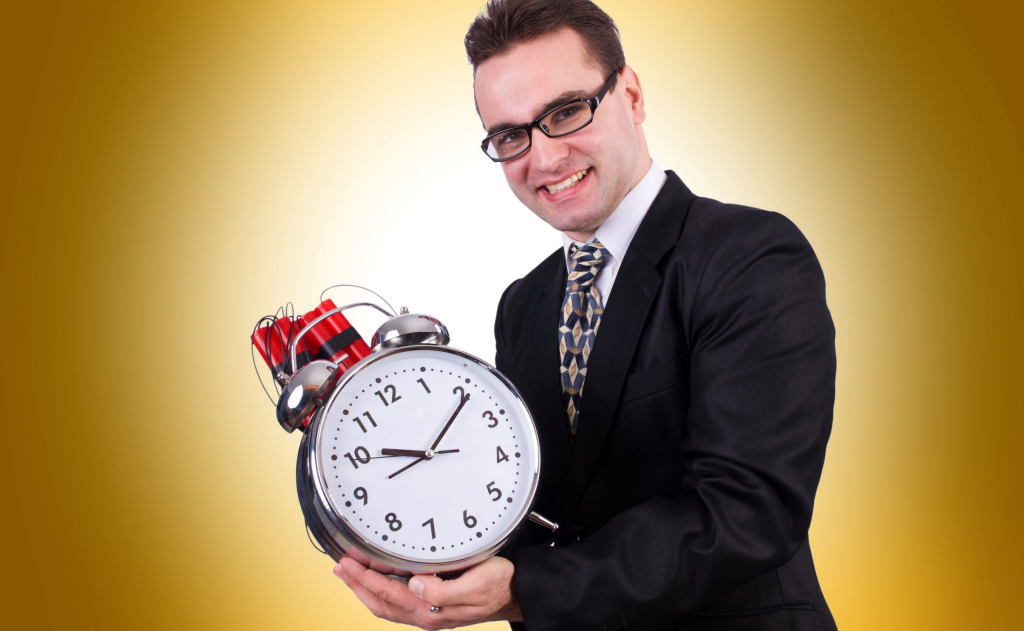 A man holding a large clock