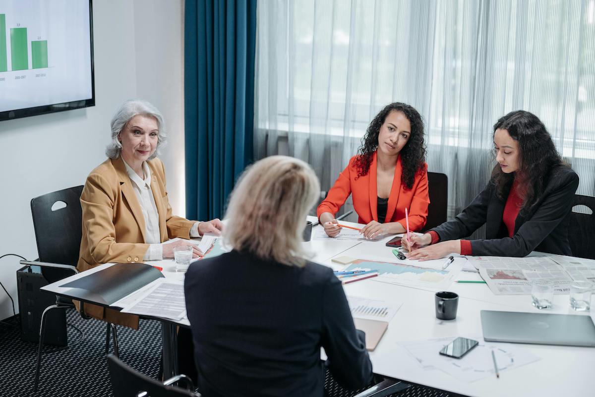 Four women having a business meeting