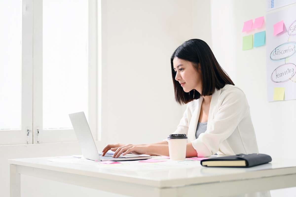 A woman working on her computer