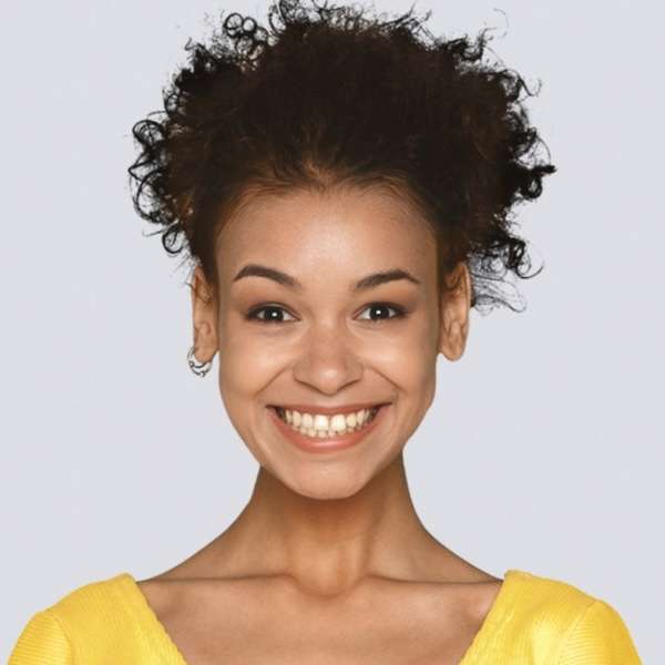 Headshot of a woman wearing a yellow top