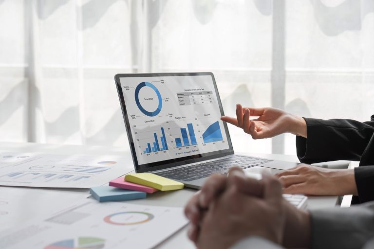 Two people reviewing the ROI of their AI investment