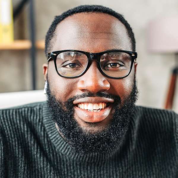 Headshot of a smiling man