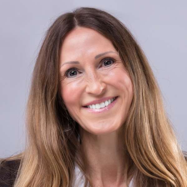 Professional headshot of a smiling woman