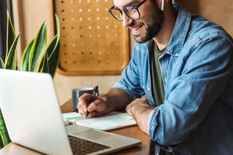 A man watching a webinar on his computer