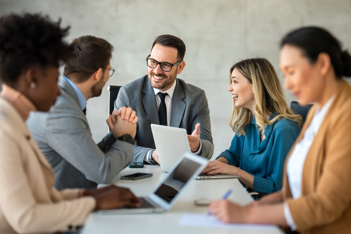A leader implementing skills from leadership training webinars with his team