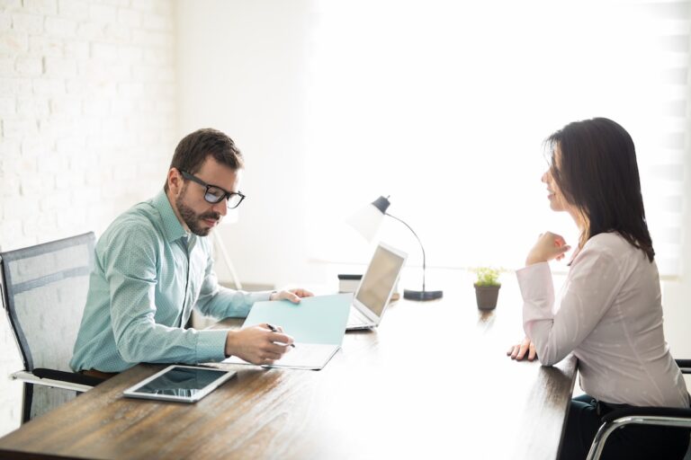 A woman asking for a raise at work