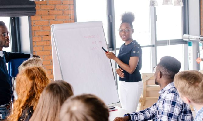 A woman and man providing training to professionals