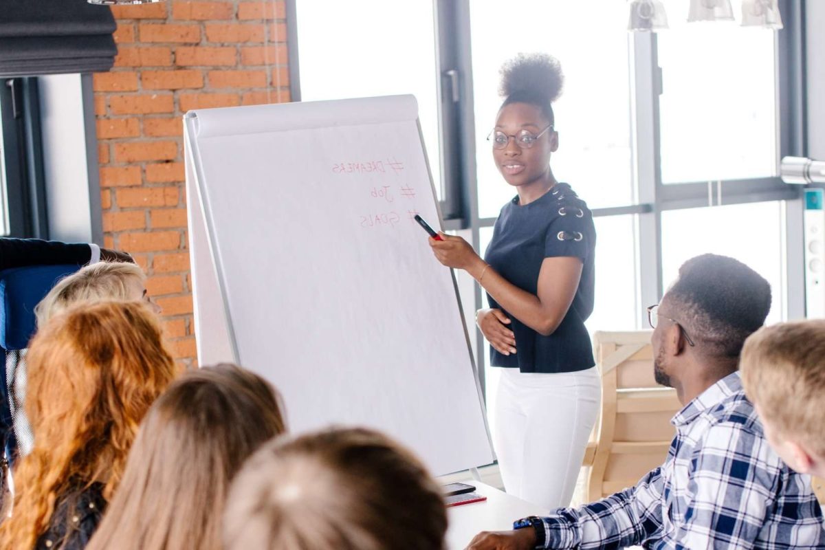 A woman and man providing training to professionals