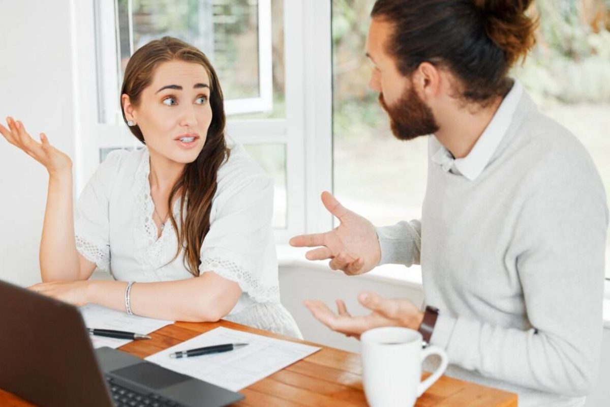 A woman and a man have a tense discussion