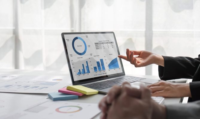 Two people reviewing the ROI of their AI investment