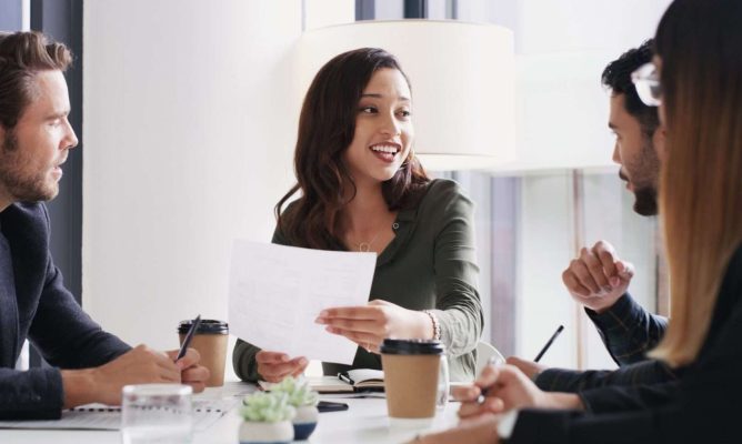 A purpose-driven team discussing with each other