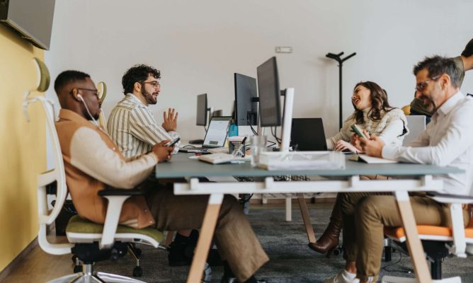 Coworkers with different personality types talking