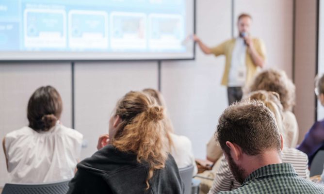 A facilitator giving a presentation