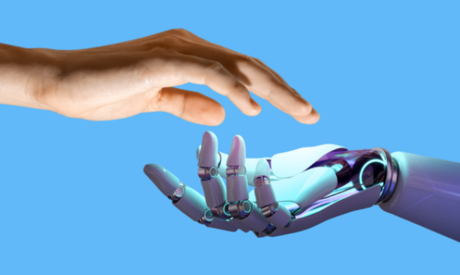 A human hand and a robot hand almost touching