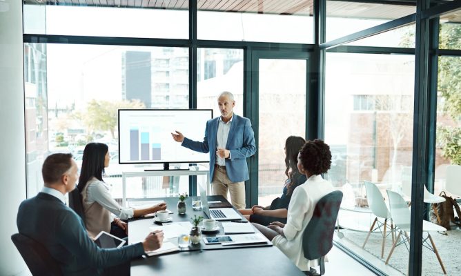 A man presenting on the learning and talent development impact
