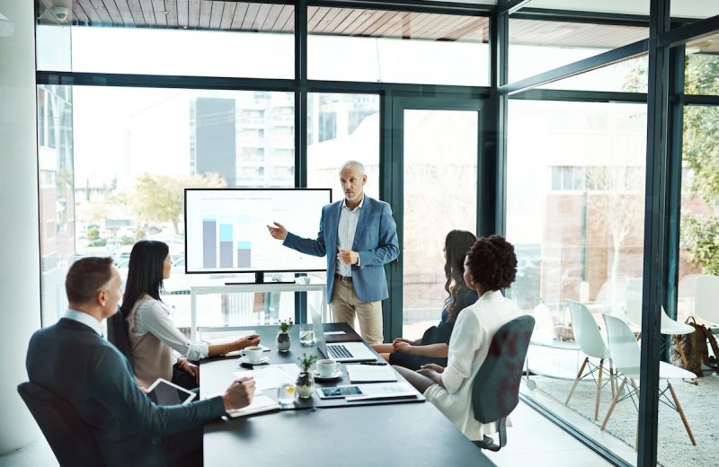 A man presenting on the learning and talent development impact