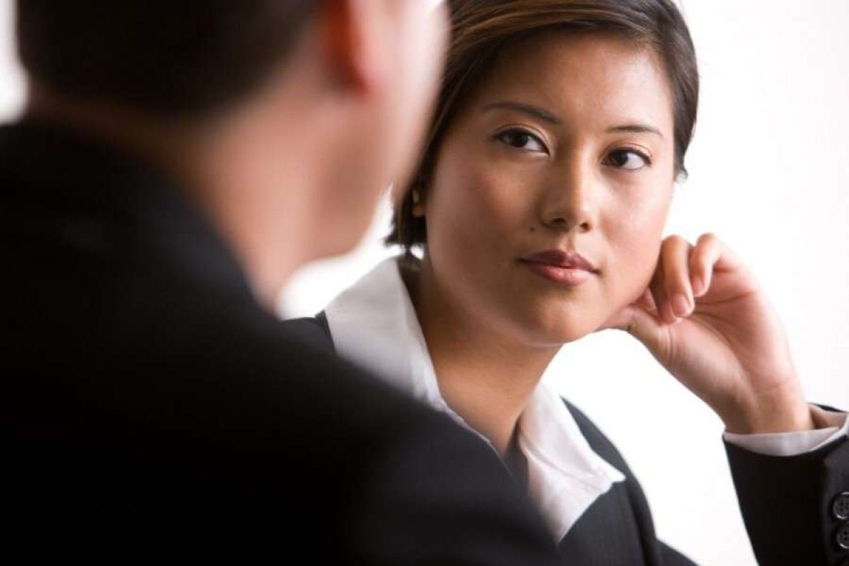 A woman looking at her coworker
