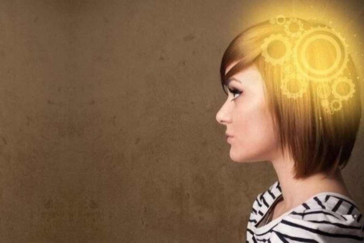 The side view of a woman with gears turning in her head