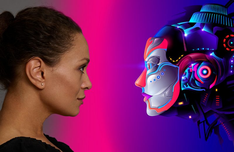 The side profiles of a woman and a robot staring at each other