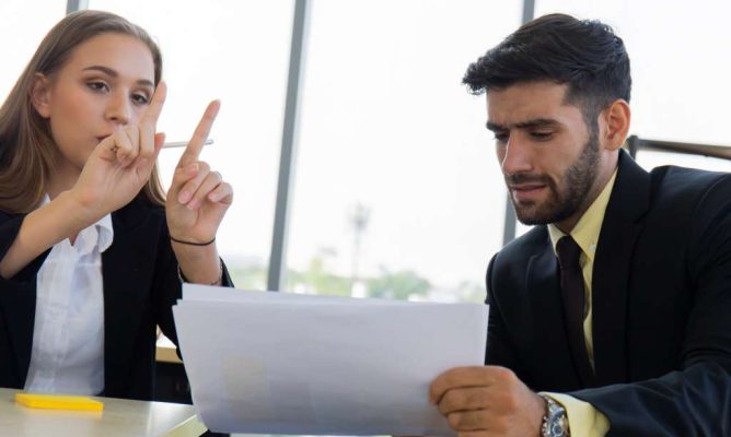 A woman and her male colleague working together