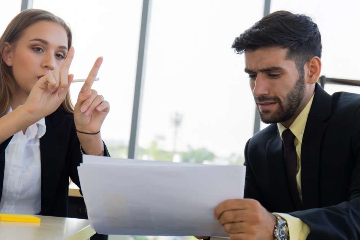 A woman and her male colleague working together