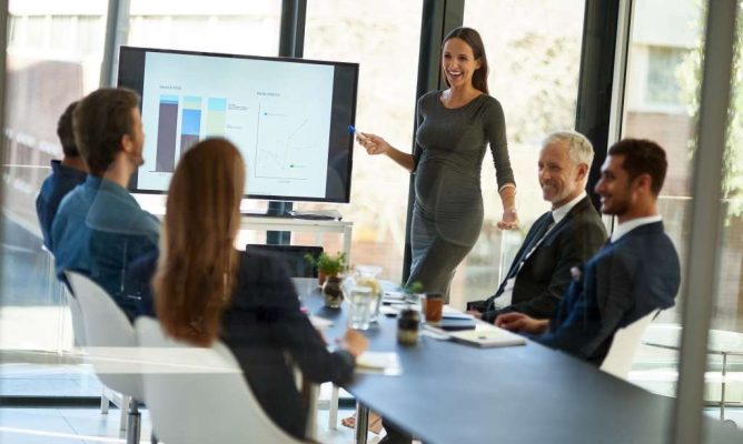 businesswoman giving slide presentation