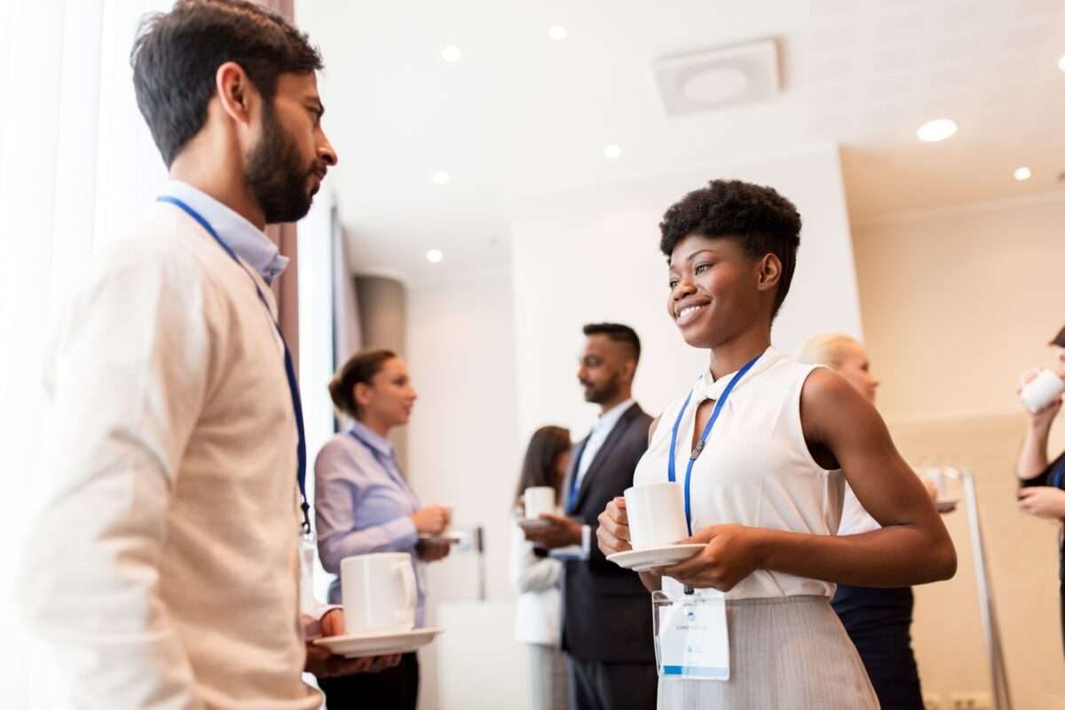 A woman and a man talking at a networking event