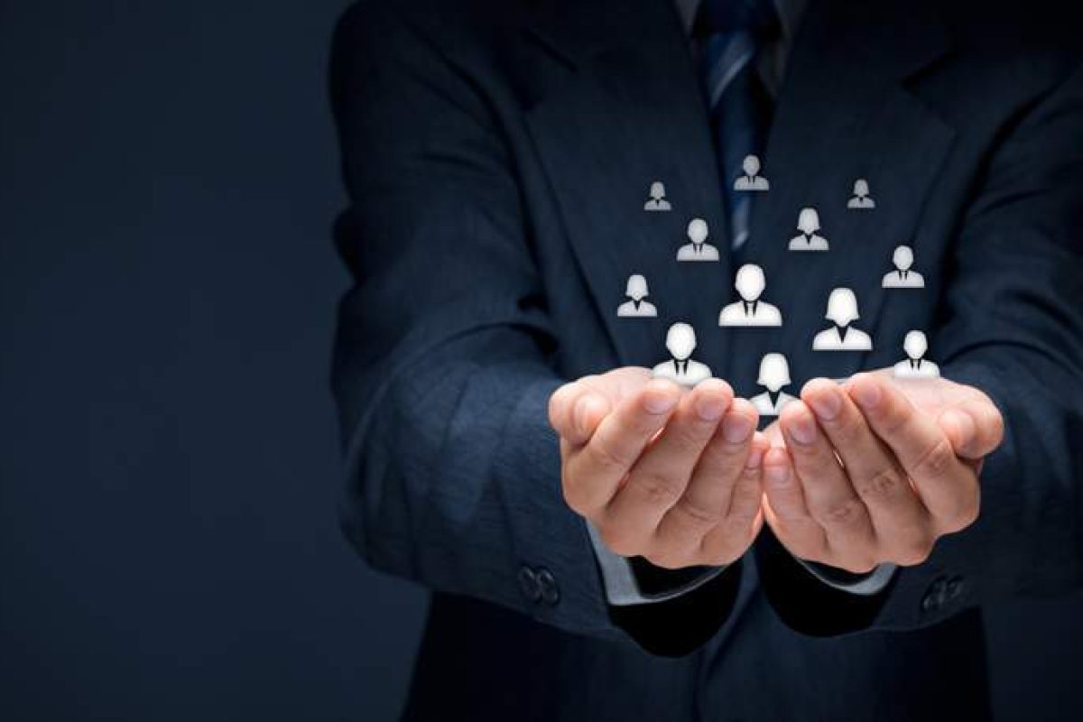 A man's hands cupped together with widgets of people floating up